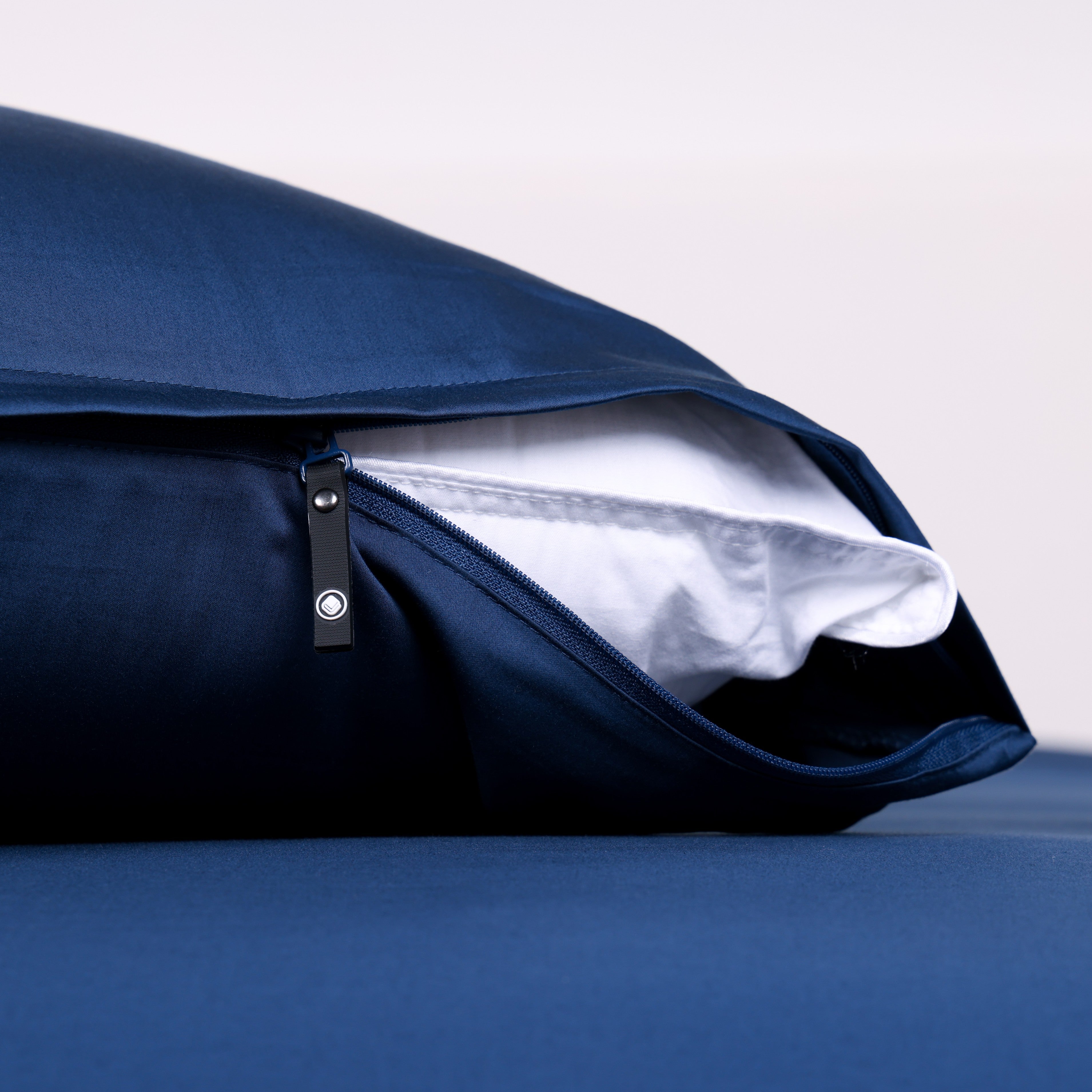 Close-up of The Lad Collective navy blue bamboo cotton blend pillowcase with invisible zipper, offering a sleek, secure, and breathable bedding solution.