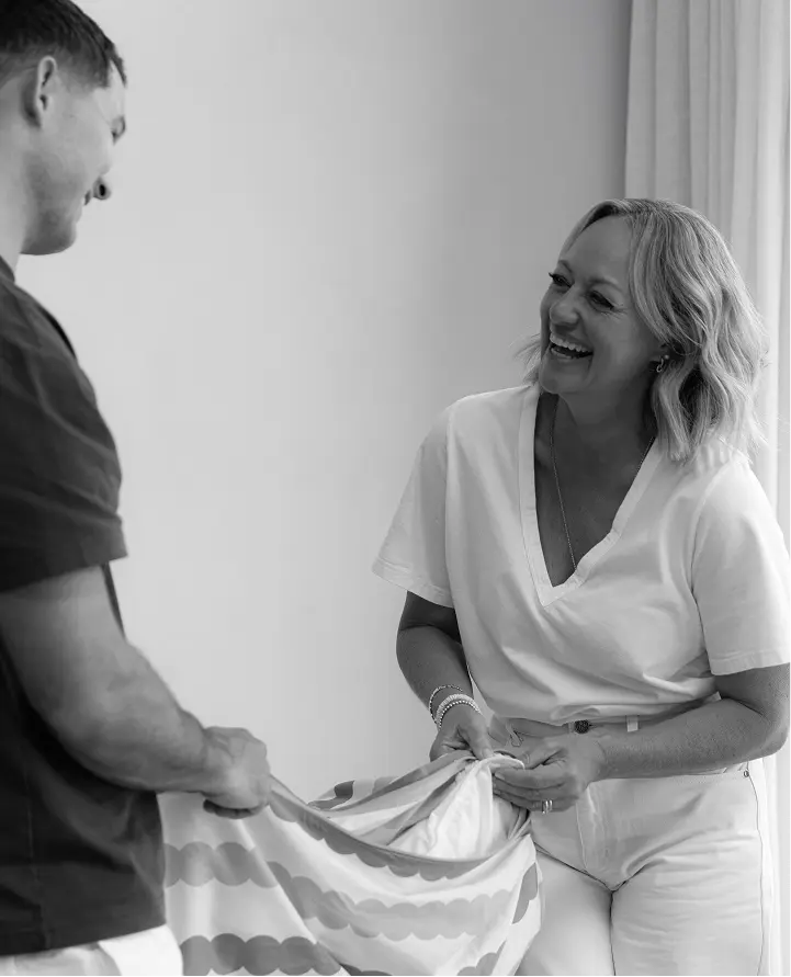 Ed and his mum making a bed together