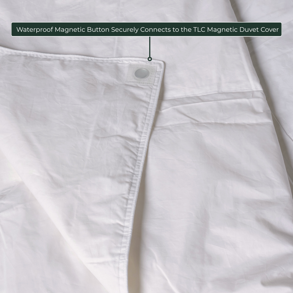 Close-up of waterproof magnetic button on comforter insert, designed to connect with TLC Magnetic Duvet Cover.