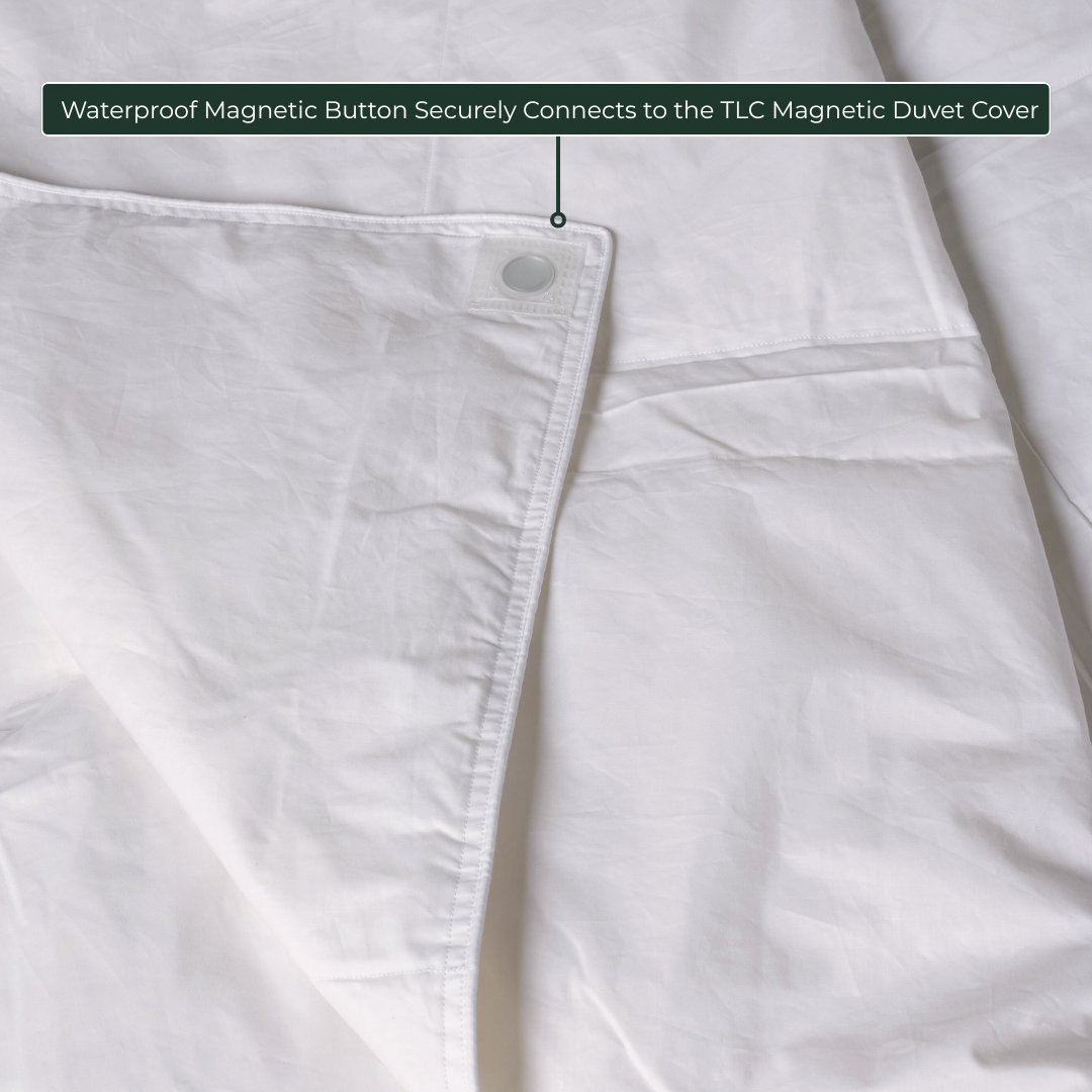 Close-up of waterproof magnetic button on comforter insert, designed to connect with TLC Magnetic Duvet Cover.