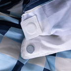 Close-up of magnetic corner fastener inside the Atlantic Gingham duvet cover.