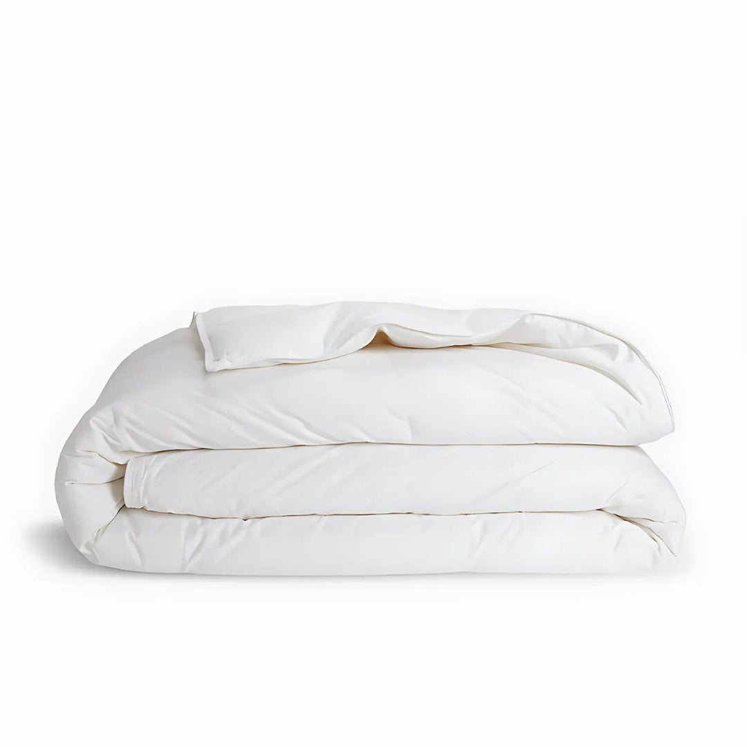 White comforter on a white background.