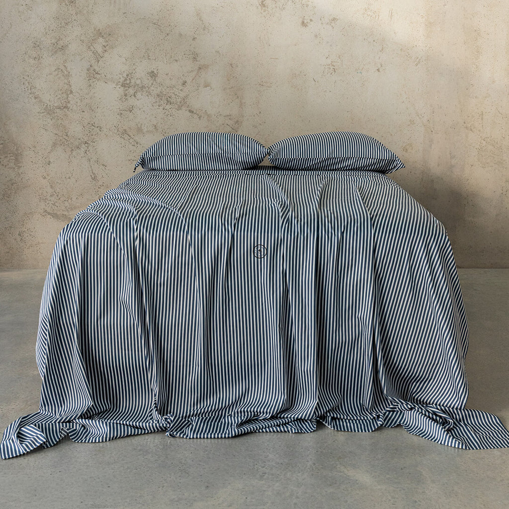 Navy and white pinstripe bedding set.