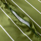 Close-up of a green jacket with a zipper on a green background