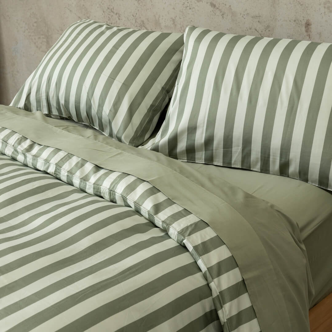 Sage green stripe duvet cover set, focusing on the two matching pillowcases.