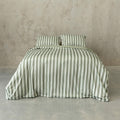 Sage green stripe duvet cover set on a bed, with a neutral background.