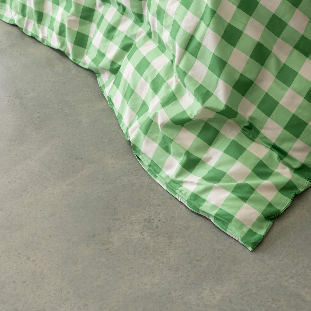 Meadow green gingham print duvet cover close up.