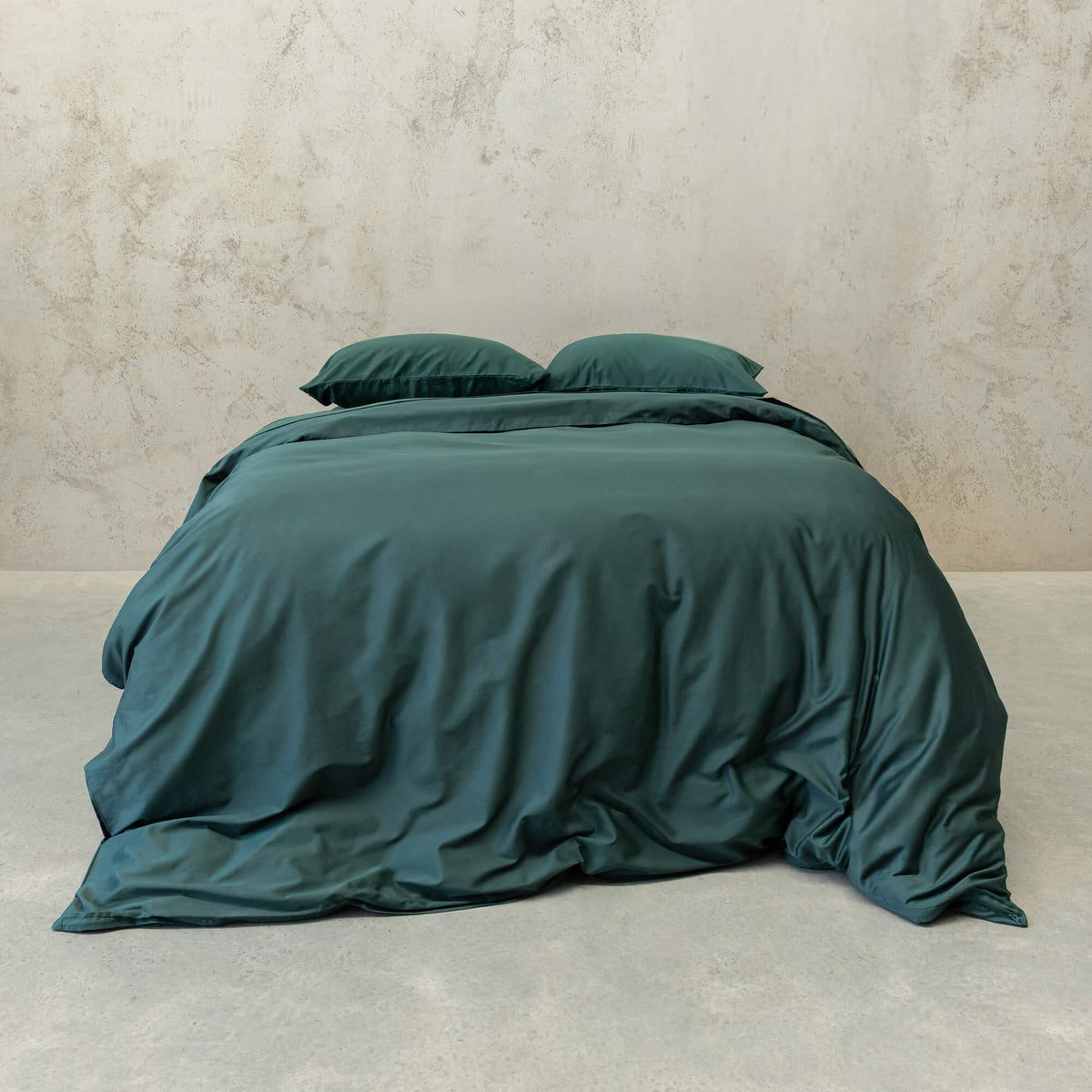Green Duvet cover bedding set on concrete background