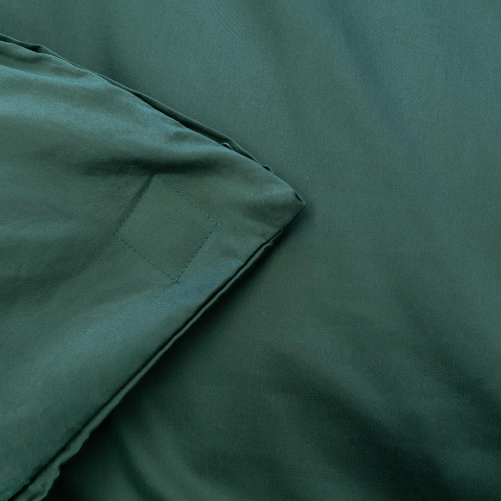Close up of magnet detail in green bedding