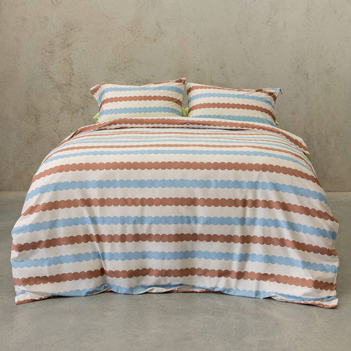 Striped bedspread with brown and blue pattern on a plain background.