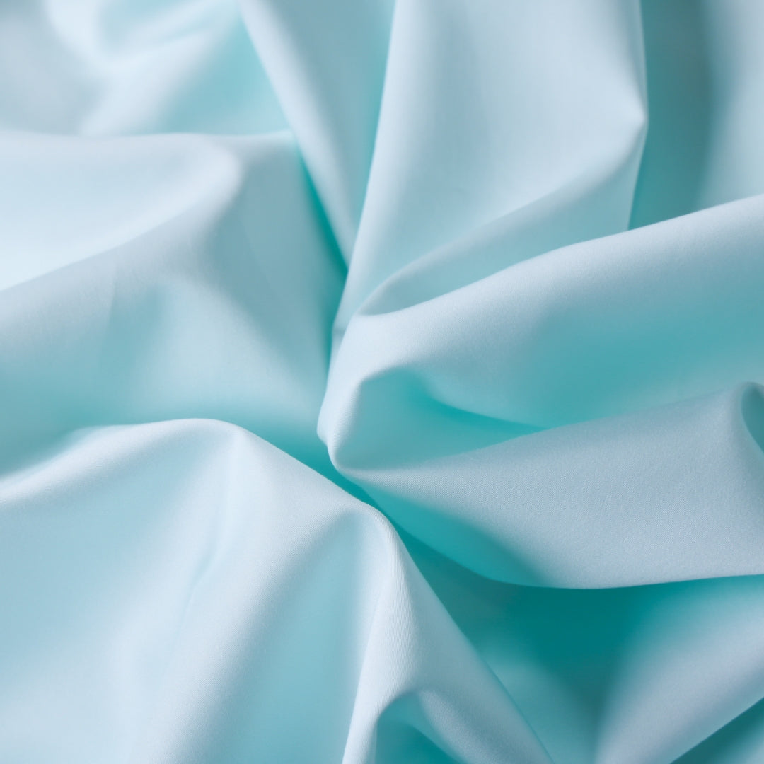 Detailed texture of Riviera Blue fabric showing its soft, smooth finish.