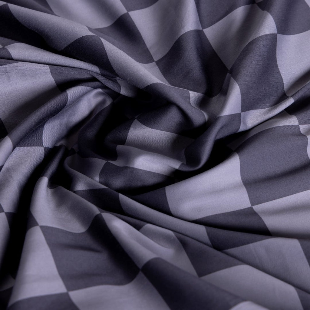 Checkered fabric pattern in shades of gray.