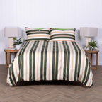 Striped bedspread on a bed with matching pillows in a bedroom setting.