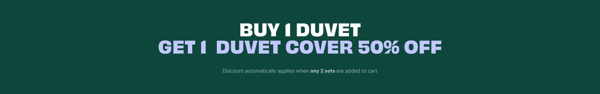A promotional banner with a dark green background and bold white text reading 'BUY I DUVET GET I DUVET COVER 50% OFF' with smaller fine print below.