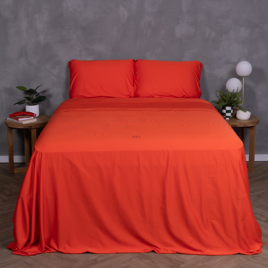 Full view of TLC Red Rock bedding set with styled bedside tables and vibrant desert-inspired design.