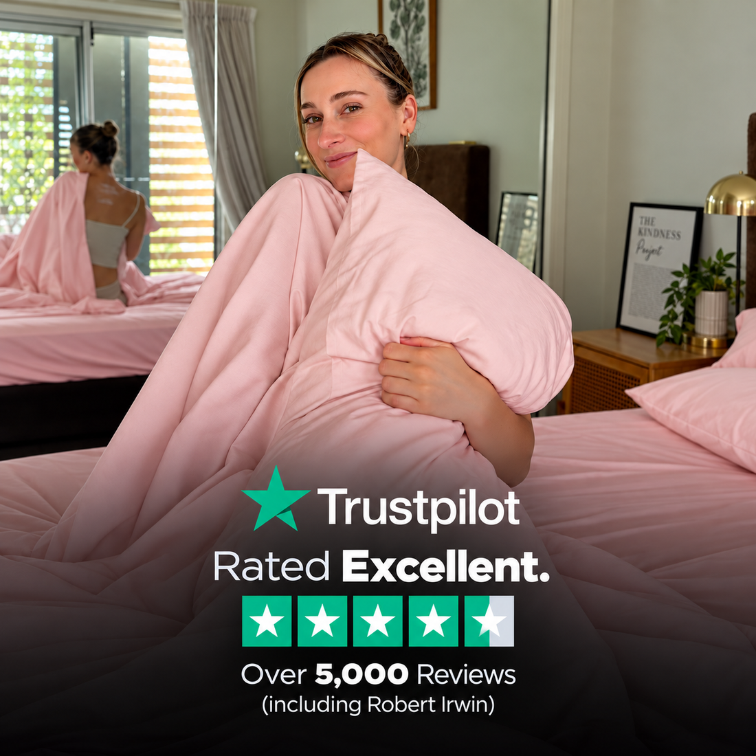 Woman holding South Padre pink bedding — Trustpilot rated Excellent, over 5,000 reviews