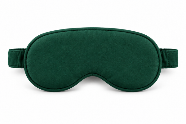 Forest-green TLC sleep mask with stitched edges and matching strap, shown separately on white
